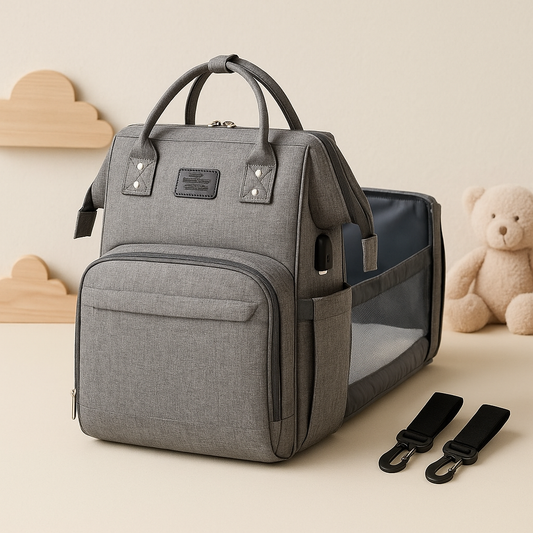 Gray baby diaper bag with dual handles, front pocket, and side straps