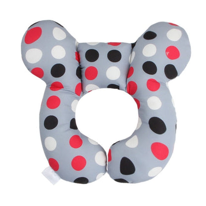 U-shaped baby head support pillow with light gray cover and red/black polka dots
