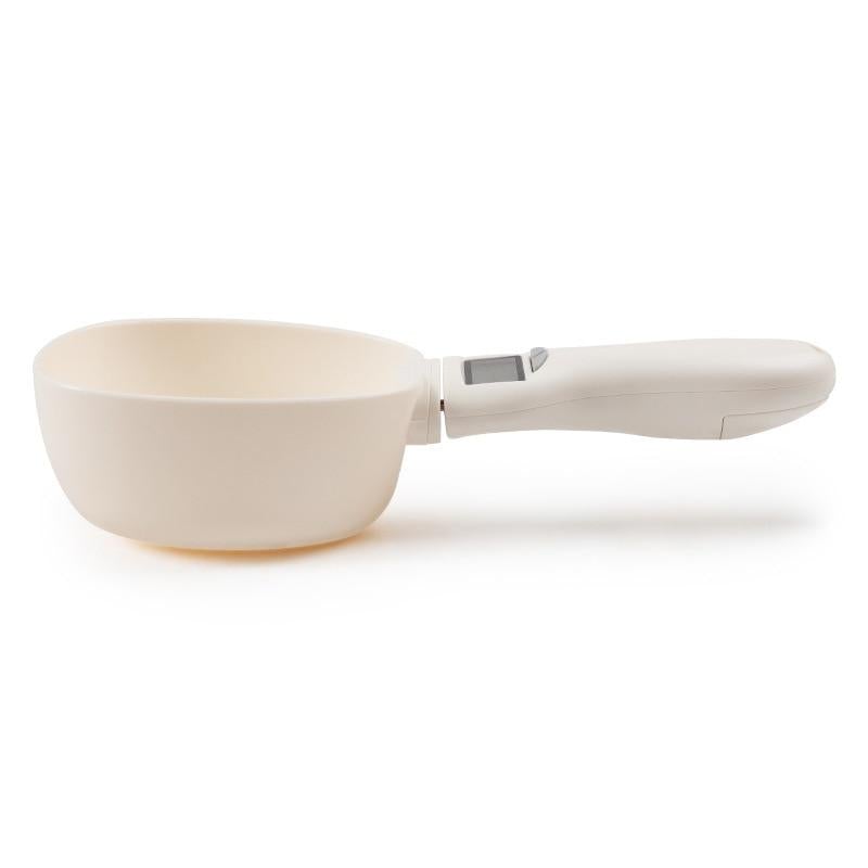 Pet food measuring scoop with digital display on handle, cream color