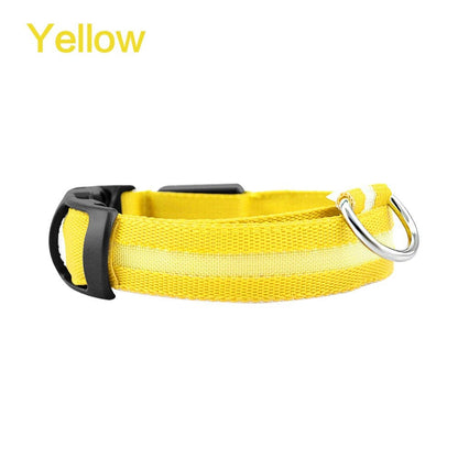 Yellow LED dog safety collar with black buckle and metal D-ring, unlit.