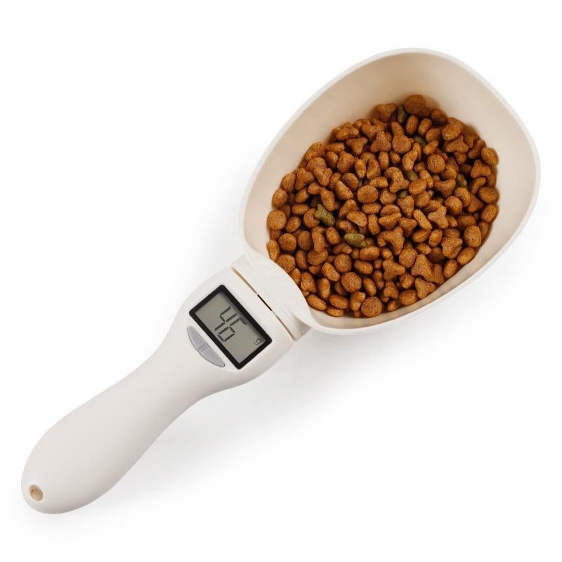 Digital measuring scoop with kibble and LCD display on handle