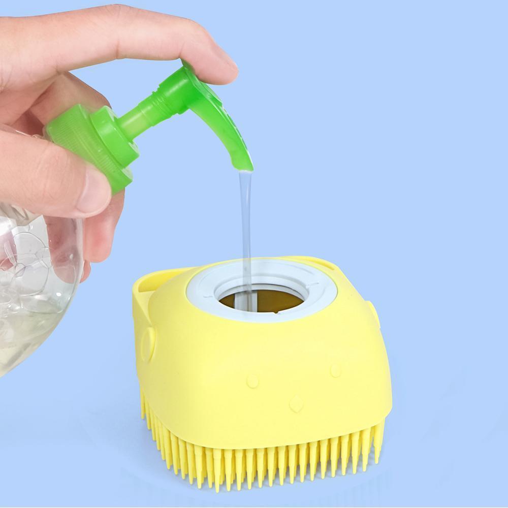 Yellow silicone body bath brush with open top and pouring water over it