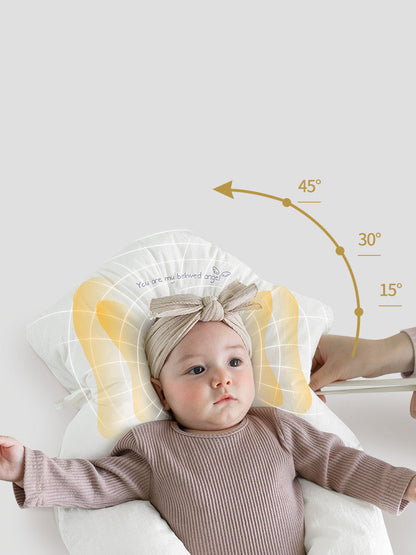 Newborn head shaping pillow, white plush U-shape with central neck support cushion