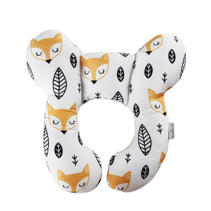 U-shaped baby head support pillow in white with sleeping fox and leaf icons