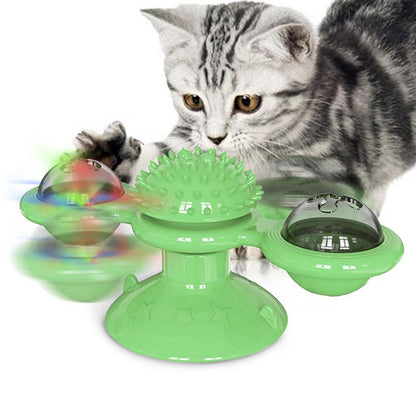 Green scratch windmill cat toy with spiky dome and three color-shifting light pods