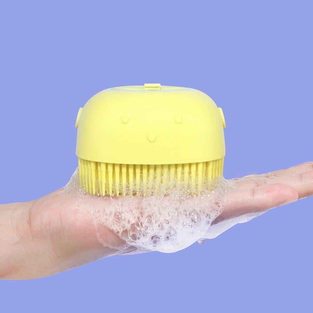 Yellow silicone body bath brush with round top and short flexible bristles