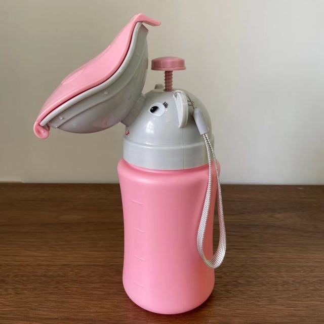 Pink portable baby travel potty urinal with white base, flip lid, and wrist strap