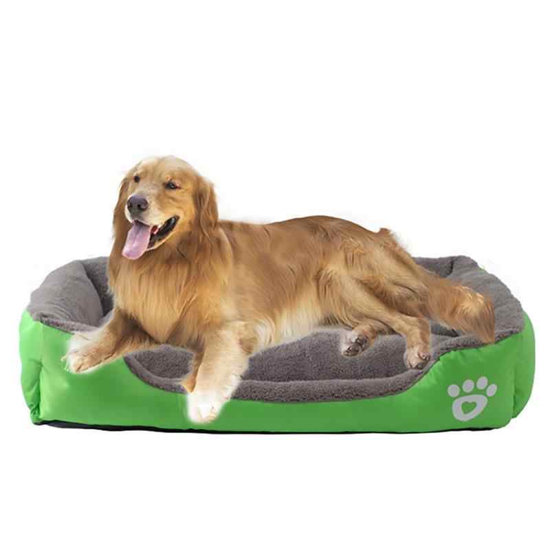 Waterproof fleece pet bed in green with gray inner cushion and white paw-print patch