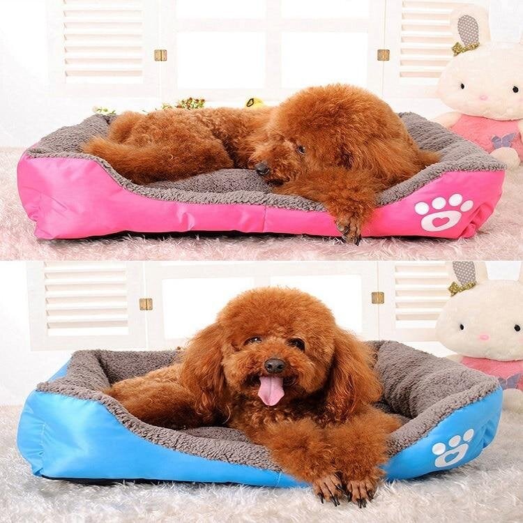 Waterproof fleece pet bed with gray inner cushion and pink outer cover with paw-print