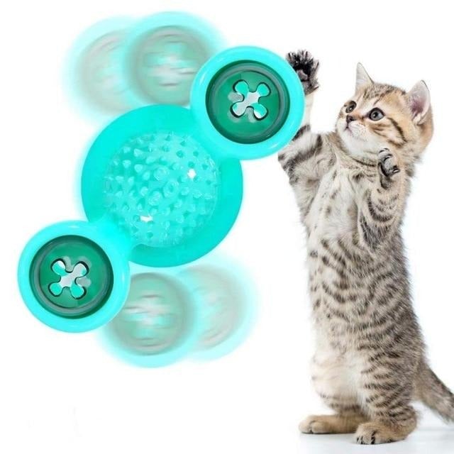 Turquoise scratch windmill cat toy with textured dome pads and three light pods