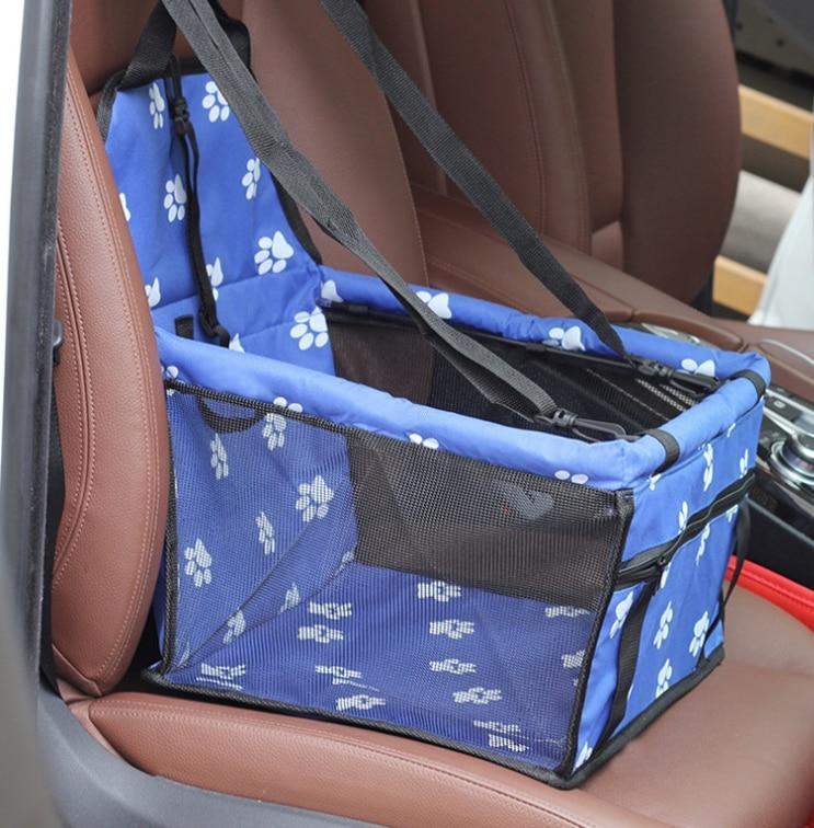 Pet car hammock seat, blue with white paw print pattern and black securing straps