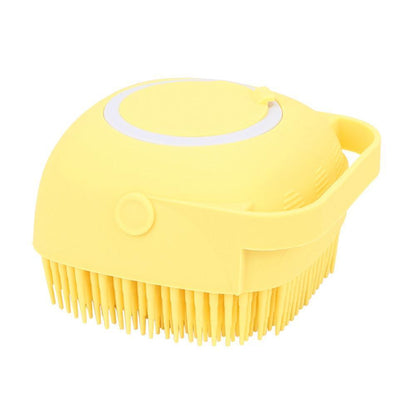 Yellow silicone body bath brush with circular top opening and side handle