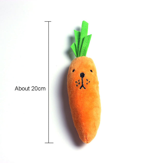 Carrot-shaped plush baby toy with green leafy top, about 20 cm