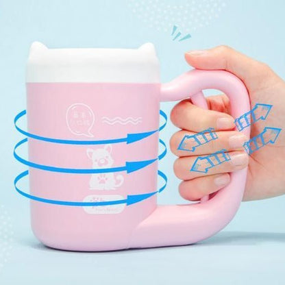 Pink portable dog paw-cleaning cup with handle and rotating brush action
