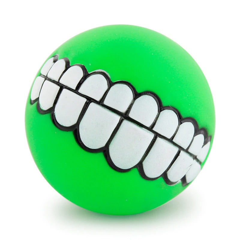 Green rubber pet teeth squeaky ball with white outlined tooth row detail.