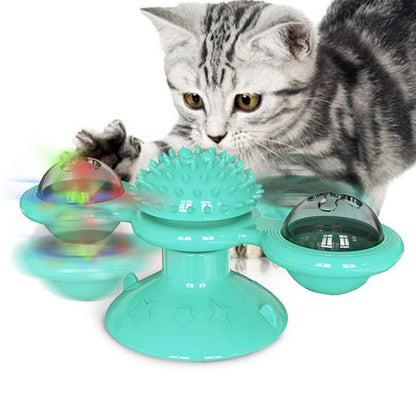 Turquoise scratch windmill cat toy with spiky dome and three color-shifting light pods